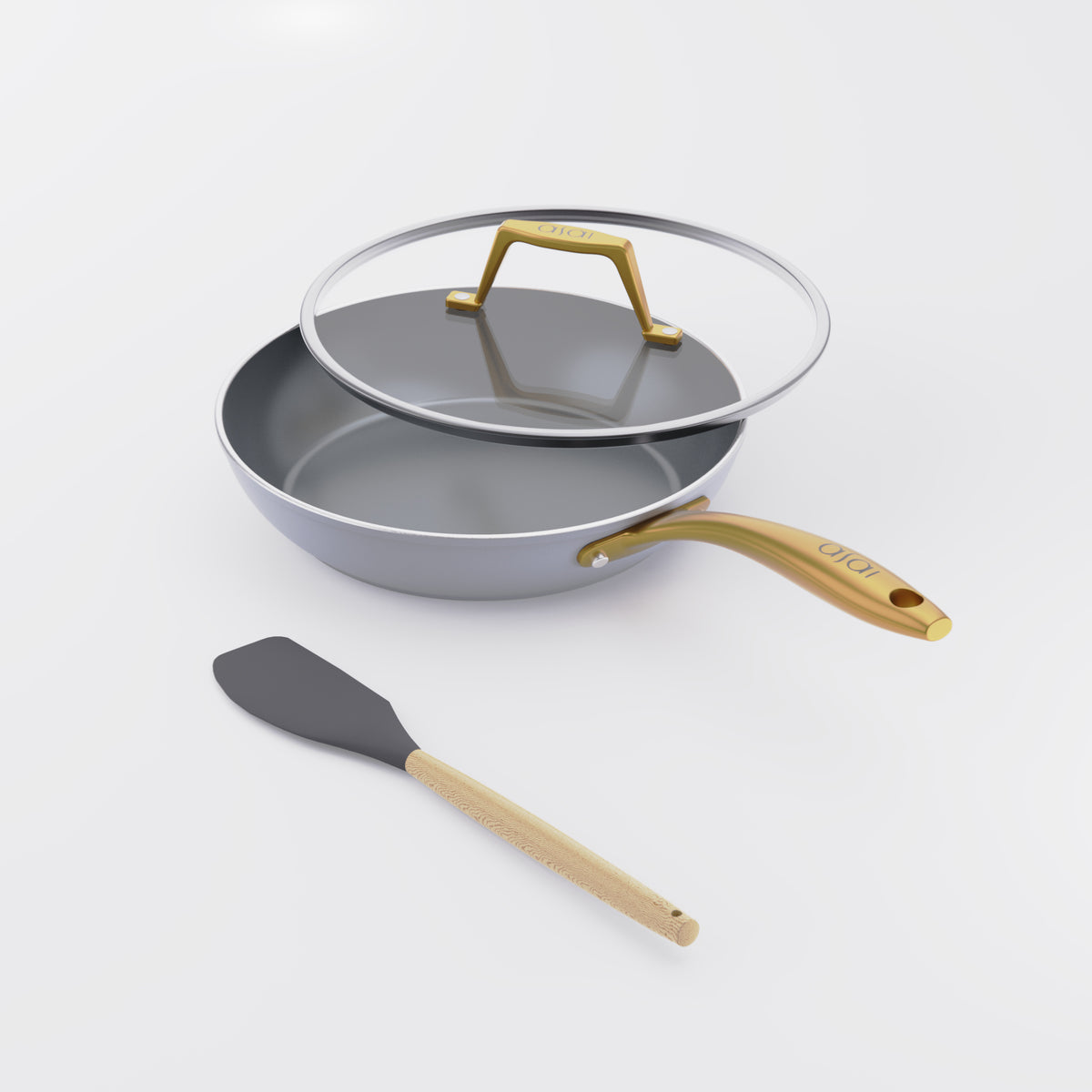 Asai Ceramic Frying Pan in Clay Grey with gold handle, lid and silicone spatula
