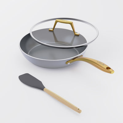 Asai Ceramic Frying Pan in Clay Grey with gold handle, lid and silicone spatula