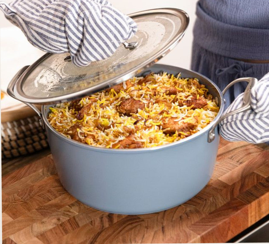 Customer cooking pulao in the Asai dutch oven